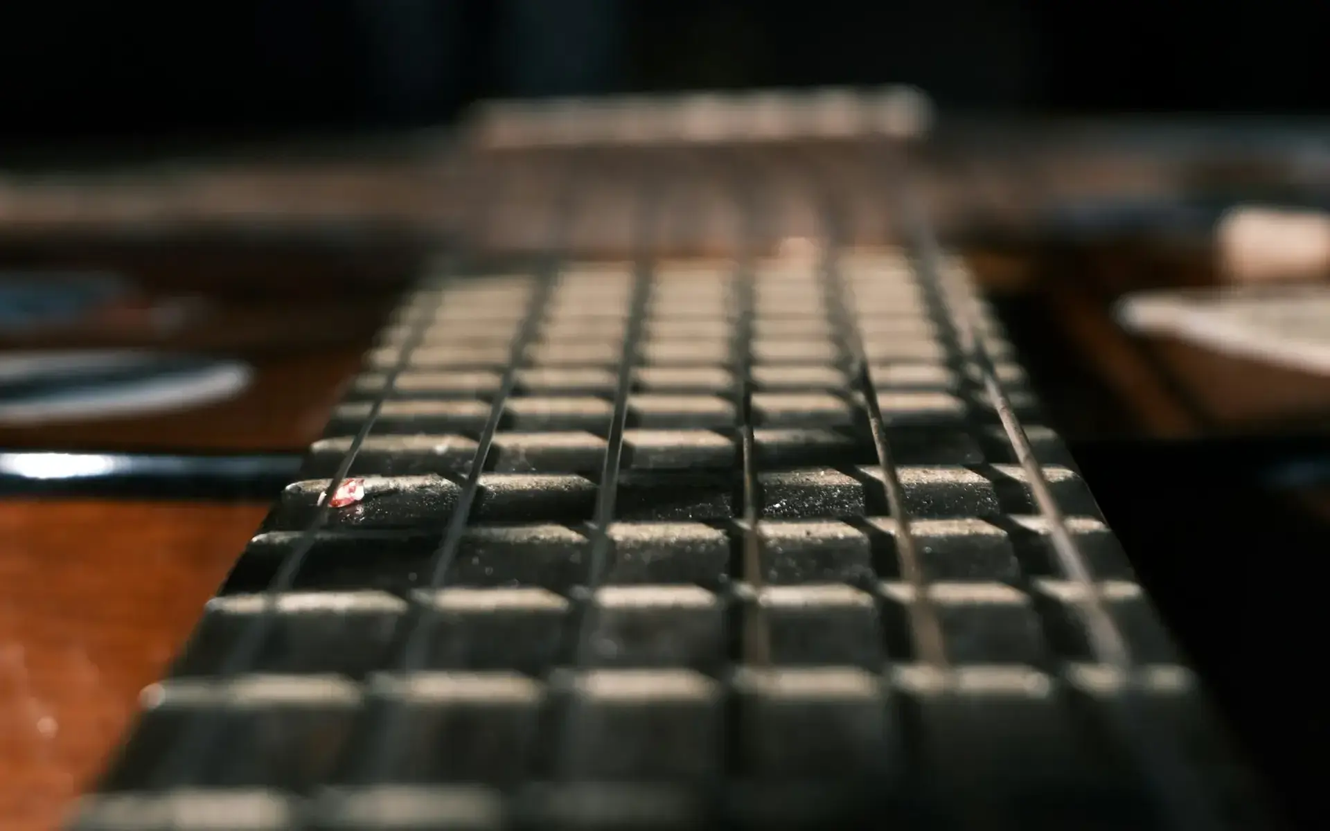 Close-up of guitar fretboard and strings in dramatic lighting